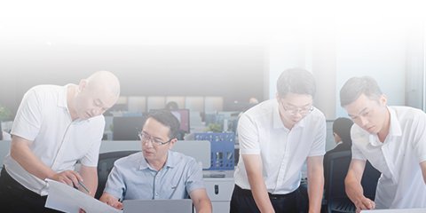 WENXIN engineering team reviewing production documents in the company office